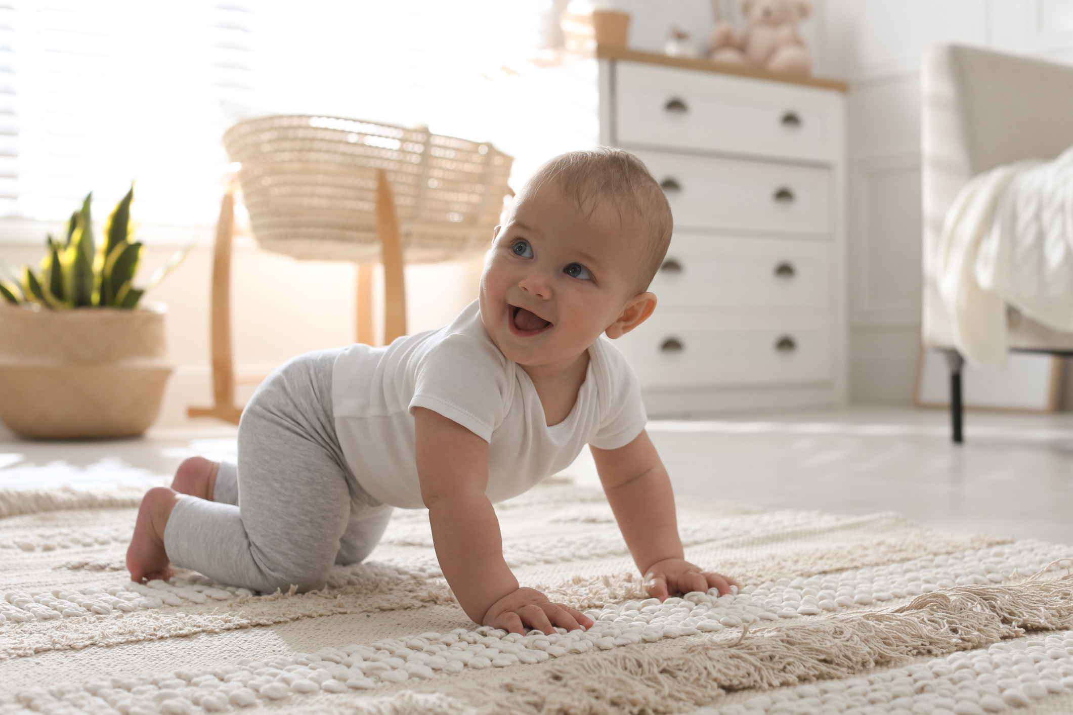 Cute Baby Crawling On Floor At Home
